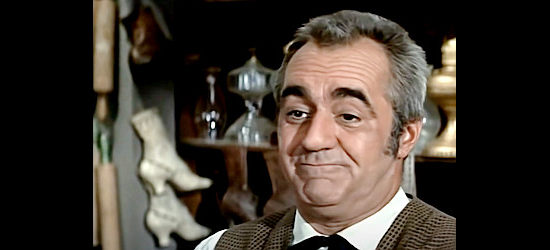 Jim Backus as Cecil Forbes, owner of the general store in Casper in The Wild and the Innocent (1959)