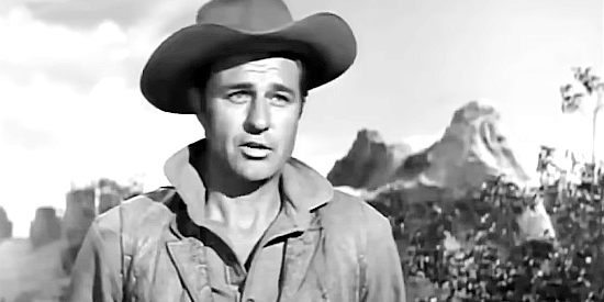 Jim Davis as Ben Ziegler, explaining the state of affairs to Katawan in Apache Warrior (1957)