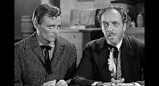 Jim Goodwin as Georgie Briggs, the eyes for his blind poker-playing father Felix (I. Stanford Jolley) in The Young Guns (1956)