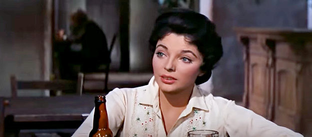Joan Collins as Josefa Velarde, enjoying a reunion with a man she once thought she loved in The Bravados (1958)