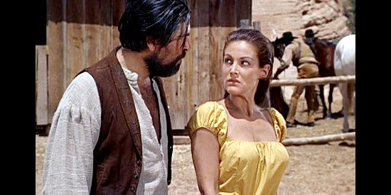 Joan Taylor as Riva, being treated harshly by one of the Mexican men just before an Apache attack in War Drums (1957)