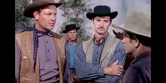 Joel McCrea as Kip Davis and Zachary Scott as Charlie Burns, recruiting wagon drivers in South of St. Louis (1949)