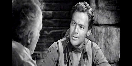 John Agar as Deputy Billy Shear, preparing a will for Pop Keith in Along the Great Divide (1951)