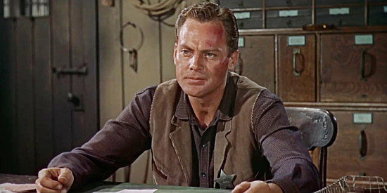 John Agar as Sheriff Bill Jordan, determined to find out who brought a killer to Gunlock and fearing it's his fiancee's brother in Star in the Dust (1956)