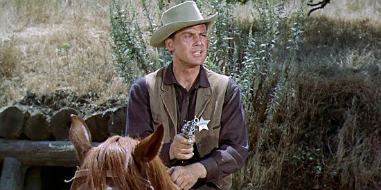 John Agar as Sheriff Bill Jordan, trying to prevent open warefare between farmers and cattlemen on the streets of Gunlock in Star in the Dust (1956)