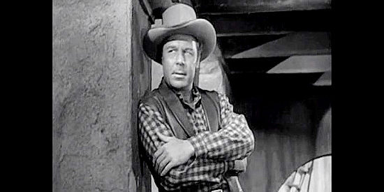 John Archer as Reno Blake, taking a quick dislike to new partner Wes McQueen in Colorado Territory (1949)