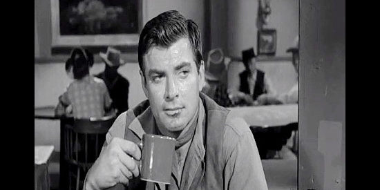 John Bromfield as Curt Darrow, interviewing a suspect in a murder investigation in Frontier Gambler (1956)