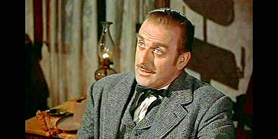 John Dehner as Ames Luddington, the attorney Larry Madden hires to dig up dirt on Tuck Ordway in Tall Man Riding (1955)