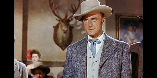 John Dehner as Tom Marsden, the man who becomes the root of Al Jenning's woes in Al Jennings of Oklahoma (1951)