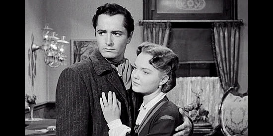 John Derek as Jed Clayton with Wanda Hendrix as Deborah Morely in The Last Posse (1953)