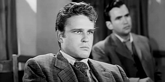 John Ericson as Jack Slade Jr., son of a controversial, quick on the draw Pinkerton agent in The Return of Jack Slade (1958)
