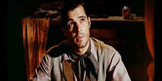 John Gavin as Teach, a young man who pitched himself as deadly with a six-gun to join Heller's gang in Quantez (1957)