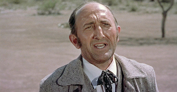 John Harmon as Mr. Massey, the government official who knew Lorna before she was married in Three Violent People (1957)