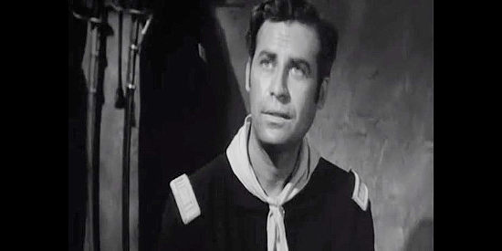 John Hodiak as Capt. Ben Lorrison, the officer who hopes to marry Ann Deverall in Ambush (1950)