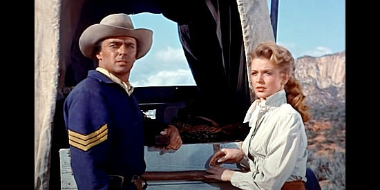 John Hudson as Sgt. Jonas and Joan Vohs as Melanie Crown, growing closer during the journey in Fort Yuma (1955)
