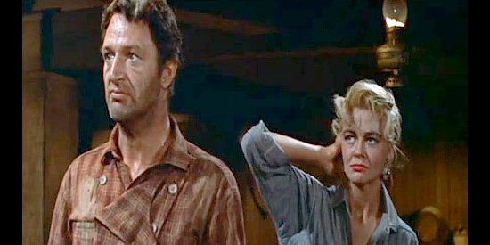 John Larsh as Heller, confronting Teach after ripping an earring off Chaney (Dorothy Malone) in Quantez (1957)