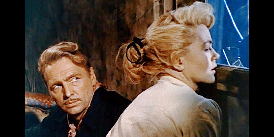 John Lund as Govern Sturges with Dorothy Malone as Shalee as she watches for trouble in Five Guns West (1955)
