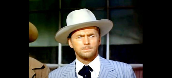 John Lund as John Hamilton (aka Carter), the mystery passenger on the stage to Laredo in Dakota Incident (1956)