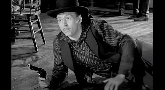 John Lund as Lance Horton, jumping into the middle of a saloon shootout in The Woman They Almost Lynched (1953)