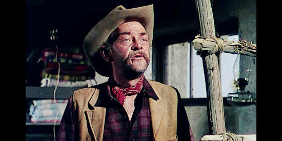 John McIntire as Dutch, wondering how Ray Cully plans to spend the money from a bank robbery in Four Guns to the Border (1954)