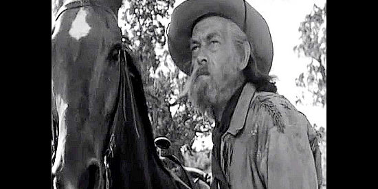John McIntire as Frank Holly, a scout for the cavalry and sidekick to Ward Kinsman in Ambush (1950)