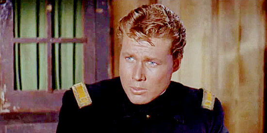 John Smith as Lt. Hostedder, the officer who led the mission in which Maylene's brother supposedly died in Quincannon, Frontier Scout (1956)