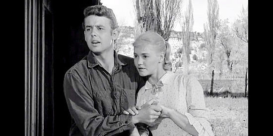 Johnny Western as Joe with Marigold (Sue George), his girlfriend ... until he learns her last name in The Dalton Girls (1957)