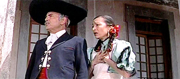 Julio Villarreal as Don Pedro and Lupe Marriles as Margarita, concerned because Panchito has gone missing in The Beast of Hollow Mountain (1956)