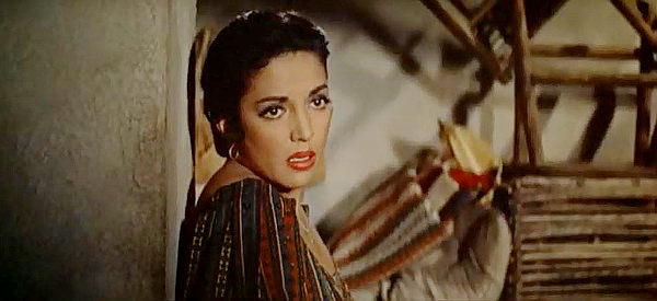 Katy Jurado as Anita, fearful McBain is about to find out about her real occupation in The Badlanders (1958)