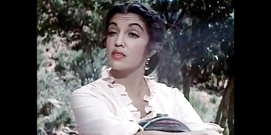 Katy Jurado as Mara Fay, trying to teach Ann the value of a canteen full of water in Dragoon Wells Massacre (1957)