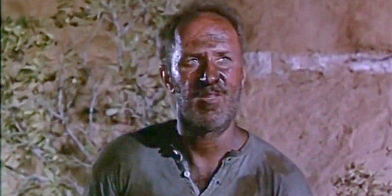 Keenan Wynn as Sam Wilkins, Haver's right-hand man in cheating folks out of their gold in The Naked Hills (1956)