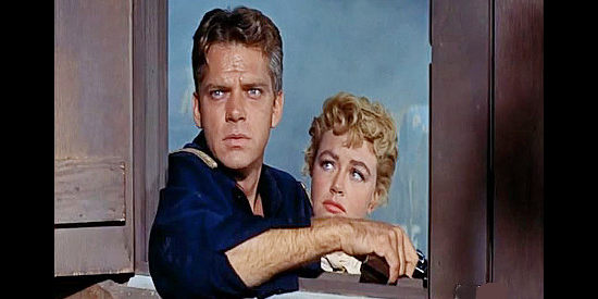 Keith Andes as Capt. Tom Gaxton, watching for another Indian attack with wife Calla (Dorothy Malone) by his side in Pillars of the Sky (1956)