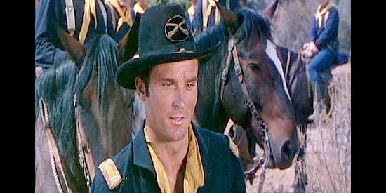 Keith Larsen as Lt. Steve King, who winds up second in command to a deserter in Arrow in the Dust (1954)