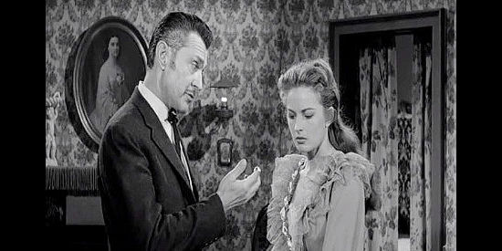 Kent Taylor as Duke Chadwick and Coleen Gray as Sylvia Melbourne, in a disagreement over the man she intends to marry in Frontier Gambler (1956)