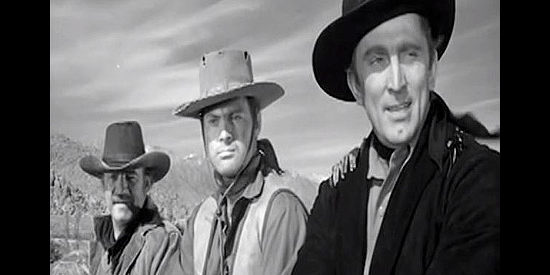 Kirk Douglas as Len Merrick, breaking up a lynching with the help of deputies Lou Gray (Ray Teal) and Billy Shear (John Agar) in Along the Great Divide (1951)