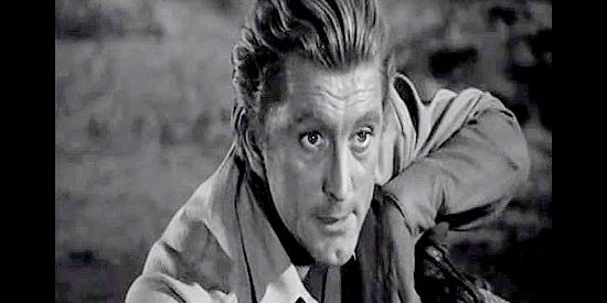 Kirk Douglas as Len Merrick, reminding his captives not to try an escape in Along the Great Divide (1951)