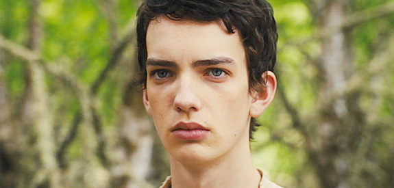 Kodi Smit-McPhee as Jay Cavendish, the young man who travels from Scotland to find the girl he loves in Slow West (2015)