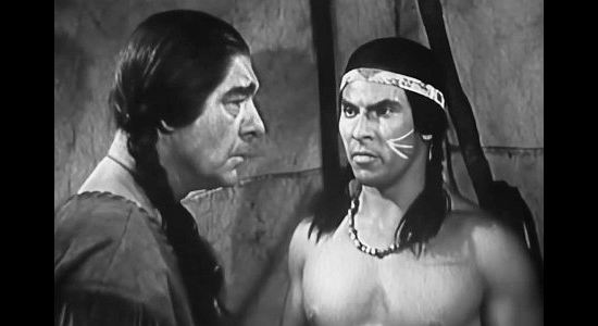 Larry Chance as Hawkbill (right) proposing a strike against Fort Detriot to Chief Pontiac (Lon Chaney Jr.) in Battles of Chief Pontiac (1952)