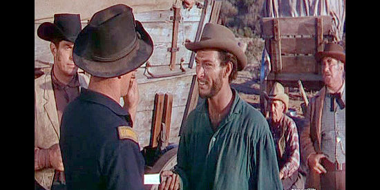 Lee Van Cleef as Tillotson's crew boss, pulling a knife on Bart Laish during a disagreement in Arrow in the Dust (1954)