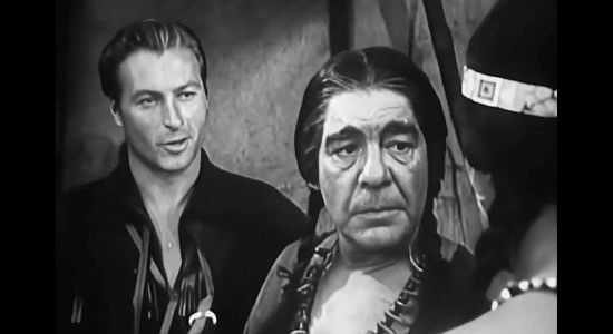 Lex Barker as Kent McIntire, Lon Chaney Jr. as Chief Pontiac and Larry Chance as Hawkbill debate the mertis of war versus peace in Battles of Chief Pontiac (1952)