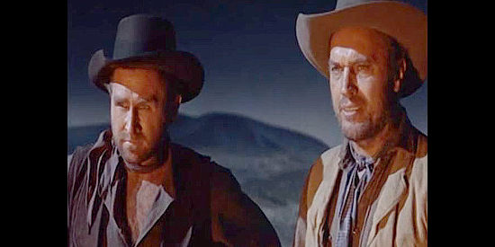 Lloyd Bridges as Gyp Clements and Robert Wilke as Ben Thompson, members of Wallace's cattle crew in Wichita (1955)