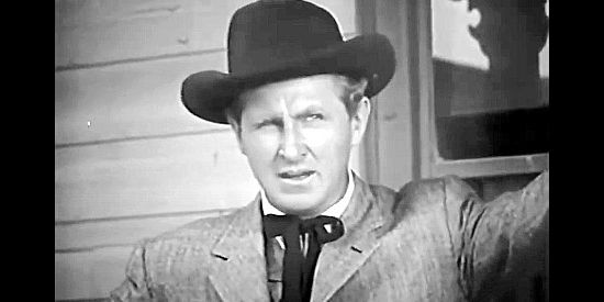 Lloyd Bridges as Rex Moffett, a government agent trying to prevent a new Indian war in Apache Woman (1955)