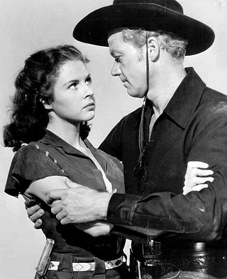 Mala Pwers as Rose and Bill Williams as George Newcomb in The Rose of Cimarron (1952)