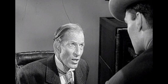 Malcolm Atterbury as Mr. Sewell, the bank owner who falls prey to the female bandits in The Dalton Girls (1957)