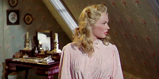 Mamie Van Doren as Ellen Ballard, wary of her brother's suspicious activity in Star in the Dust (1956)