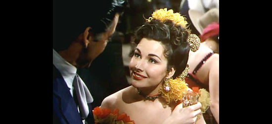 Mara Corday as Lettie Diamond, an former flame enjoying a reunion with Brett Wade in Dawn at Socorro (1954)