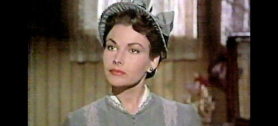 Mara Corday as Sharman Fulton, ready to leave town with Jagade to protect the man she loves in A Day of Fury (1956)