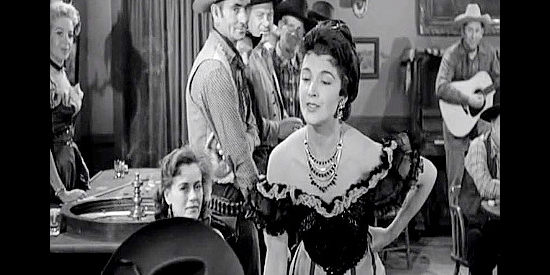 Margia Dean as Gloria Starling, the saloon singer Tony Burton sneaks around with behind Sylvia's back in Frontier Gambler (1956)