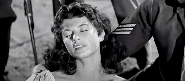 Margia Dean as Teresa Santos, dumped in Sgt. Blake's camp as a decoy in Ambush at Cimarron Pass (1958)