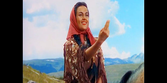 Maria Elena Marques as Kamiah, gesturing her affection to husband Flint Mitchell in Across the Wide Missouri (1951)